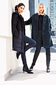 Two young women in winter fashion in shades of blue on the street