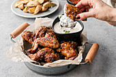 Chicken wings with dips and potatoe wedges