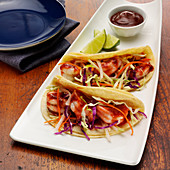 Shrimps and cole slaw tacos with BBQ sauce