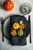 Place setting for Thanksgiving festive dinner decorated with pumpkins