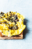 Toast with scrambled eggs, mushrooms and mustard