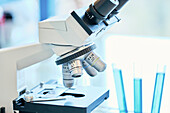 Microscope and test tubes in a laboratory