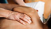 Ayurveda back and shoulder massage with ayurvedic oil