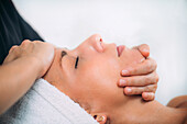 Ayurvedic face massage therapy with aromatherapy oils