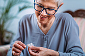 Senior woman doing crocheting