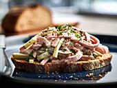 Meat with pickled vegetables on wheat bread