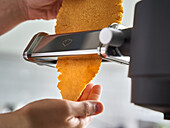 Making chickpea pasta with a pasta machine