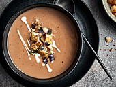 Chestnut soup with croutons and red watercress