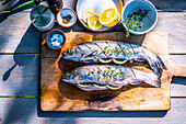 Fresh trout with lemon and herbs prepared for the grill