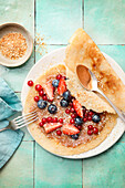 Vegan almond crepes with fresh berries