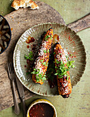 Smokey grilled corn on the cob with BBQ sauce