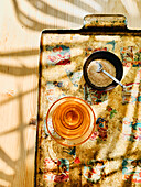 A cup of mint tea and brown sugar in a small bowl on a tray
