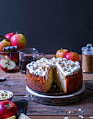 Apple meringue cake with cinnamon on a wooden table