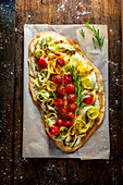 Tarte flambée with summer squash and cherry tomatoes