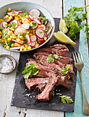 Griled beefsteaks with radish and sweet corn salad
