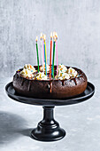 Chocolate birthday cake with cream cheese and sprinkles