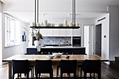 Shaker-style cupboards and an oversized island bench topped with honed dolomite stone