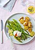 Green asparagus with sauce Hollandaise, poched egg and potatoes