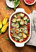 Courgette rolls with ricotta and tomato sauce