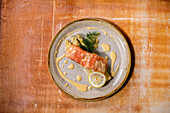 Salmon fish with white asparagus, lemon and hollandaise sauce