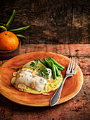 Cod with garlic cream and green beans