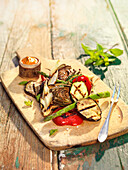 Mediterranean grilled vegetables on a wooden tray