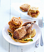 Baked quail with apples and potato fritters