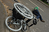 Young man after falling from his wheelchair