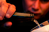 Man pouring beer into a glass