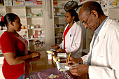 Pharmacy customer asks the pharmacist for prescription drugs