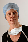 Close-up of a hospital worker wearing a hygiene mask and hat