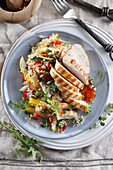 Healthy salad with quinoa and grilled chicken