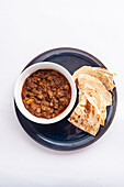 Sorpotel (meat dish, India) with paratha