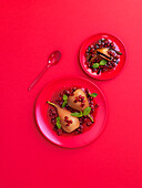 Red wine pears with pomegranate seeds