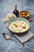 Cream of parmesan soup with croutons and aged balsamic vinegar