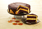 Cocoa cake with pumpkin cream and chocolate glaze