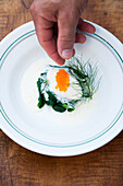 Trout dumplings with trout caviar on a bed of spinach from Baden