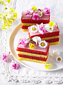 Slices of summer punch bars garnished with edible flowers