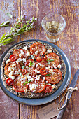 Quinoa pizza with tomatoes and feta