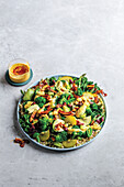 Greens and grains salad with caramelised coconut and tropical curry dressing