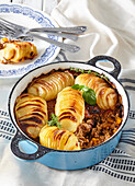 Gratinated Hasselback potatoes with minced meat