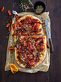 Leavened cake with dried tomatoes and small peppers