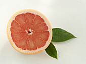 Halved pink grapefruit