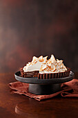 Chocolate and hazelnut meringue pie