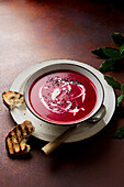 Beetroot soup with yoghurt and black onion seeds