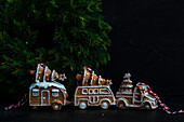Gingerbread cookies shaped in cars and trucks covered with sugar