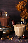 Two healthy date shake milkshakes, one is flavoured with spices