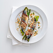 Mackerel with green asparagus wrapped in Proscuitto