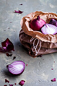 Red onions in a paper bag