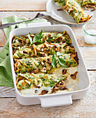 Gratinated pancakes with spinach and mushrooms
